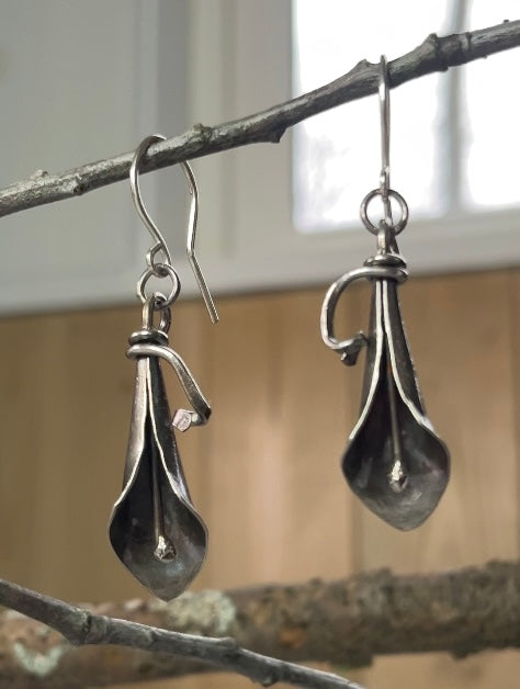Sterling silver dangle earrings formed into a sweet calla lilly bud, complete with spadix.